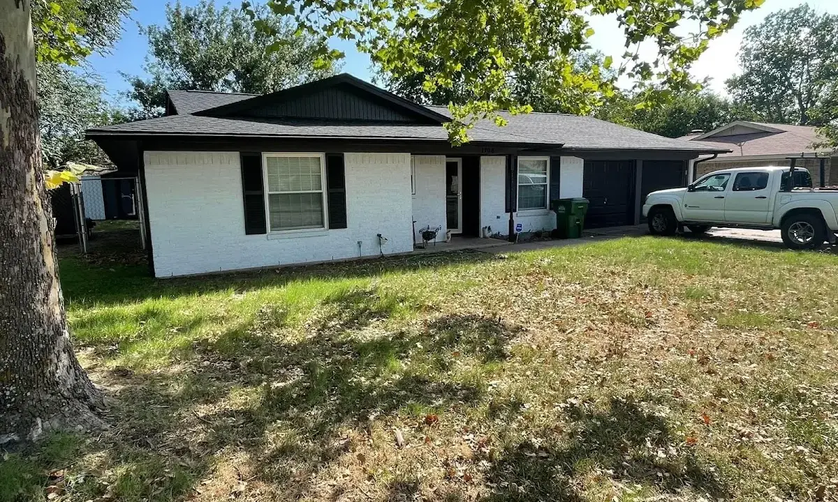 Professional roofing crew working on a residential roof in Orlando